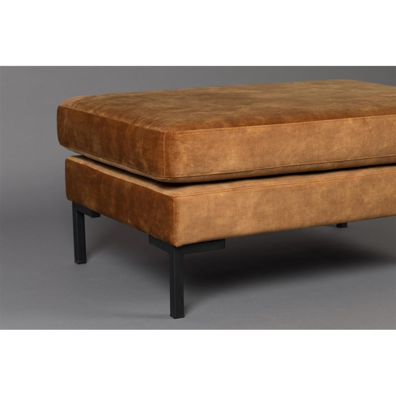 Footstool holds a caramel